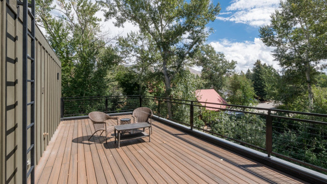 The private third story deck faces south, making it the perfect place to hang out and bask in the sun.