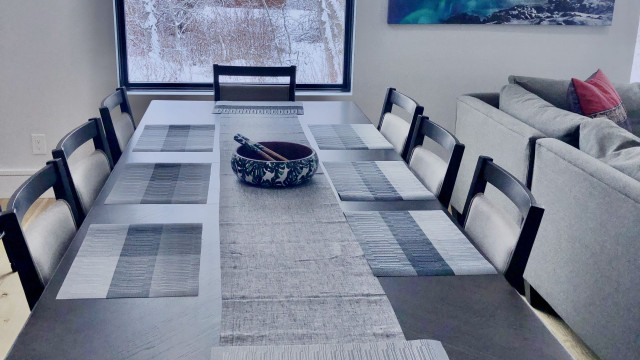 Nearly ten feet long, the contemporary dining table seats eight comfortably.