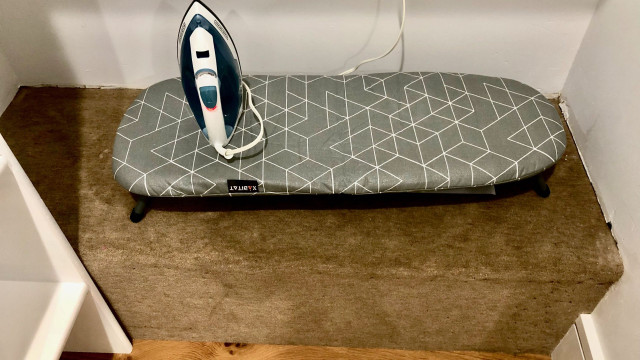 You will find an iron and ironing board in the walk-in closet off the master bedroom.