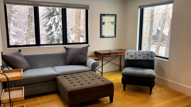 The Master Bedroom/Suite occupies the entire third level of the house. It feels like you are up in the tree tops that surround you. A King Sized Bed let's you relax in comfort and a casual sitting area is a great place to curl up with a book.