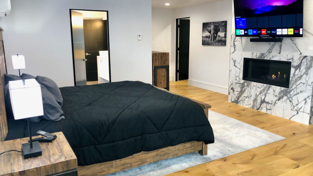 You will feel like you're in "your own world" in the third level Master Suite, with it's gas fireplace, huge ensuite bath, radiant floor heating augmented by mini-split AC/Heating and huge walk-in closet/changing room.