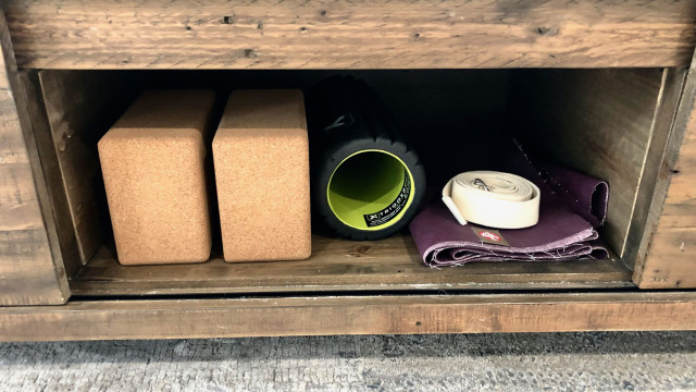 Yoga props are included in the storage compartment under the king sized bed, with plenty of room to roll out the mat at the foot of the bed.