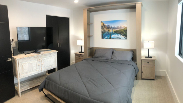 The Third Bedroom faces the private back yard. It has a comfortable Murphy Bed with plenty of room to leave it down if you're using it full time as a bedroom. Or leave it up to enjoy using it as a den or private workspace.