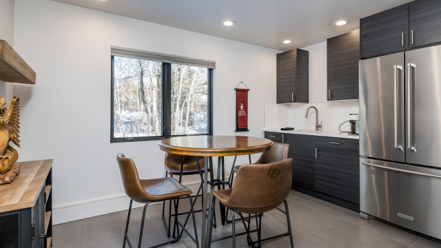 For more casual dinning or just hanging out, wander downstairs to the Family Room with a Wet Bar and additional bistro style seating for four. Note: decor items differ from those shown in photo.