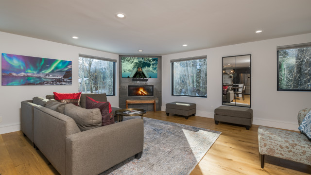 Large but cozy, the Living Room boasts a gas fireplace, lots of windows opening up to the woods around, and a 65" OLED TV w/Sonus sound bar.
Up/Down shades offer additional privacy, but most of the windows open up to the woods surrounding you.
