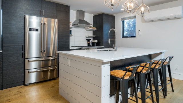 A spacious center island provides lots of work space for meal prep. A mini-split AC/Heating unit augments the in-floor radiant heating.