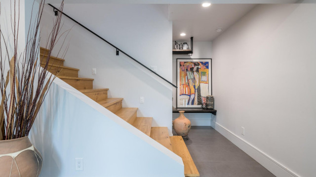 The lower level entry foyer provides a convenient place to remove foot ware and hang coats as you transition from outdoor activities to the comfort and luxury of the house.